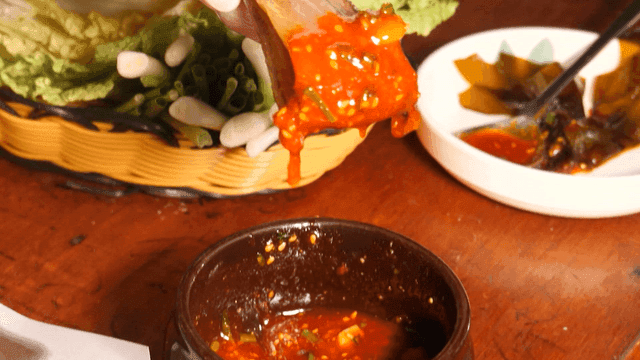 Gwamegi dipped in sauce