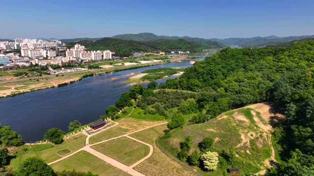 Tranquil river flowing through distant city