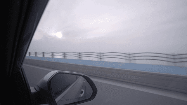 Driving on a bridge during sunset
