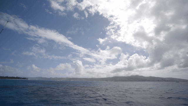 Vast ocean under a cloudy sky