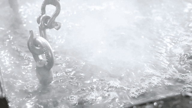 Steaming metal parts immersed in liquid
