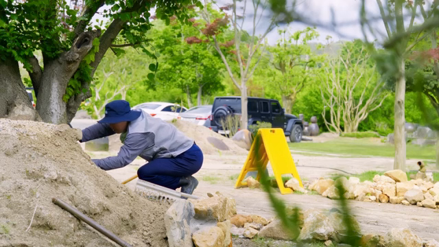Person working on a garden landscape