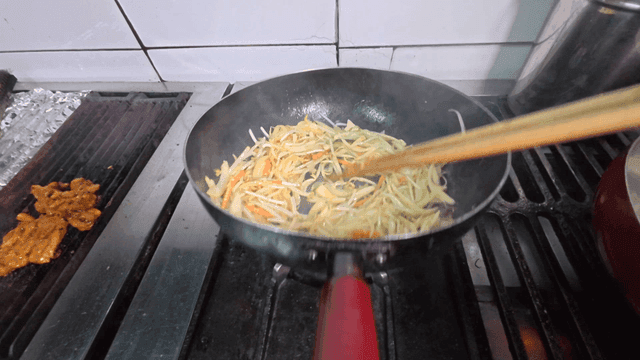 Stir-frying vegetables in a pan