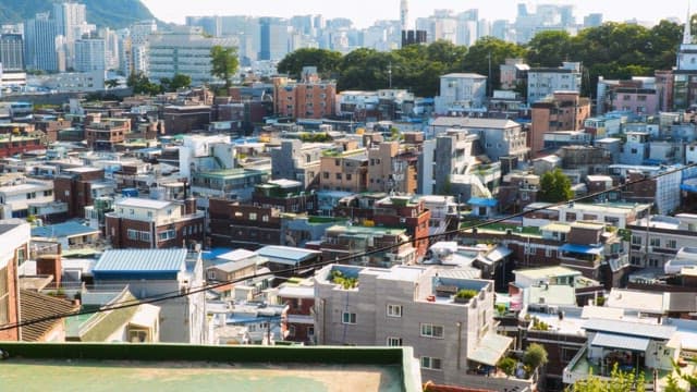 View of a densely packed urban area under a bright sky