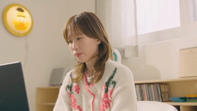 Woman working on a laptop at home