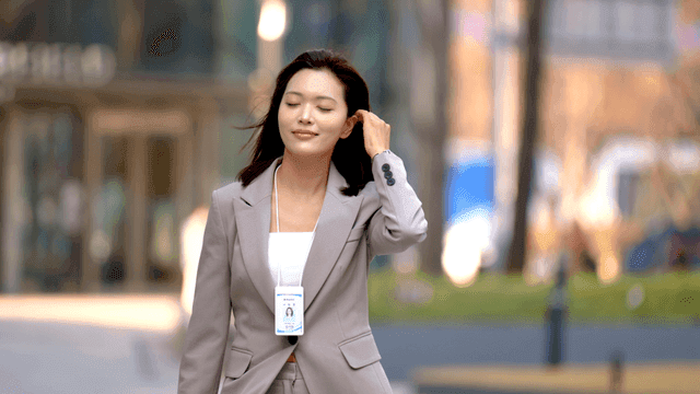 Working woman walking confidently in suit