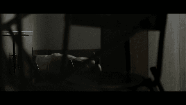School violence in dark classroom with stacked chairs