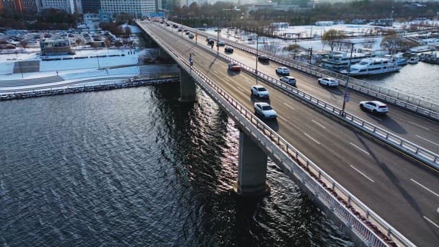 Traffic on Riverside Bridge in Winter