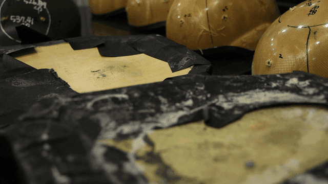Worn protective gear on a workbench