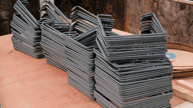 Steel rods stacked at a construction site