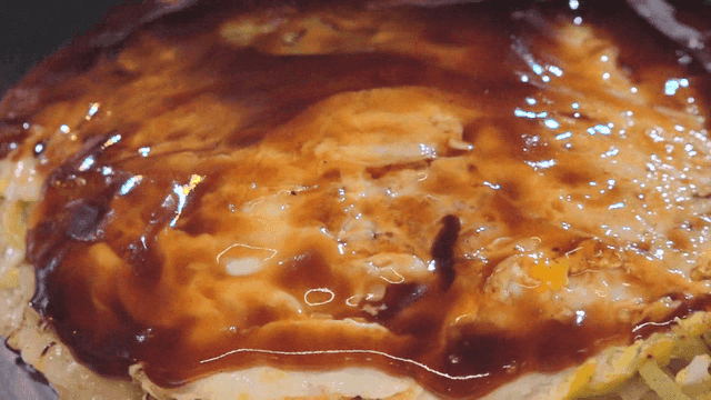 Brush Applying Teriyaki Sauce On Okonomiyaki