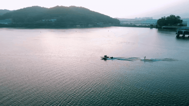 Person water skiing on calm lake
