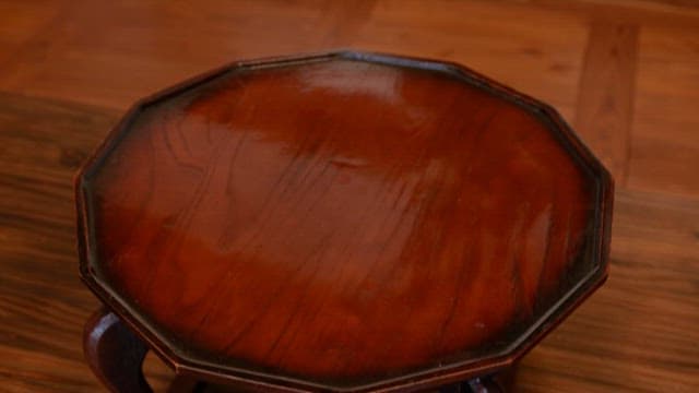 Traditional Wooden Table being Set with Korean Meal