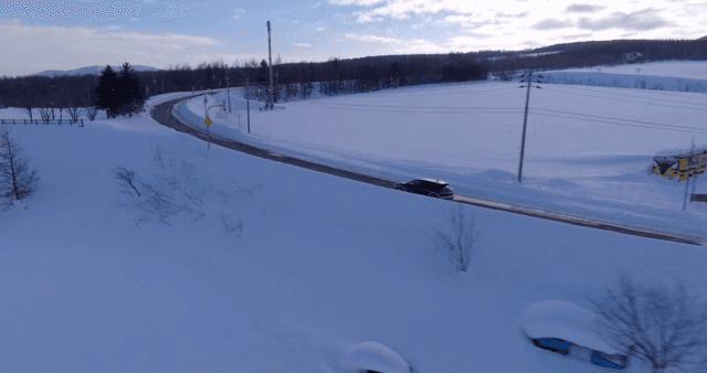Car driving on a snowy road