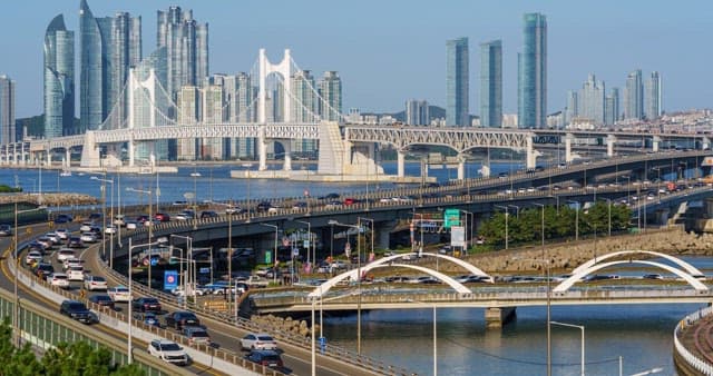 Traffic on a busy Gwangan Bridge and highway in a city