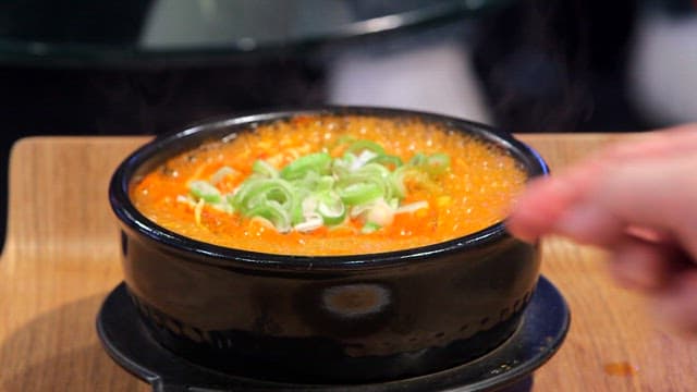 Spicy seafood ramyeon with eggs and cheese