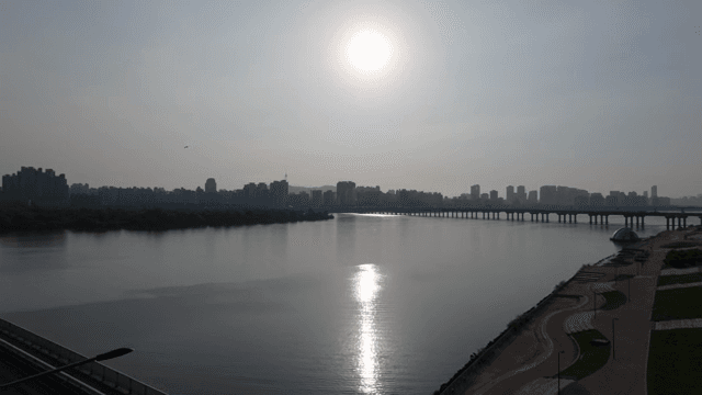 City skyline with a river and bridge