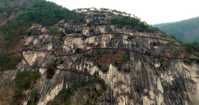 Winding Walking Path Surrounded by Steep Cliffs