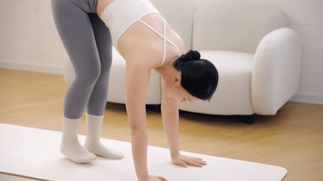 Woman practicing yoga indoors