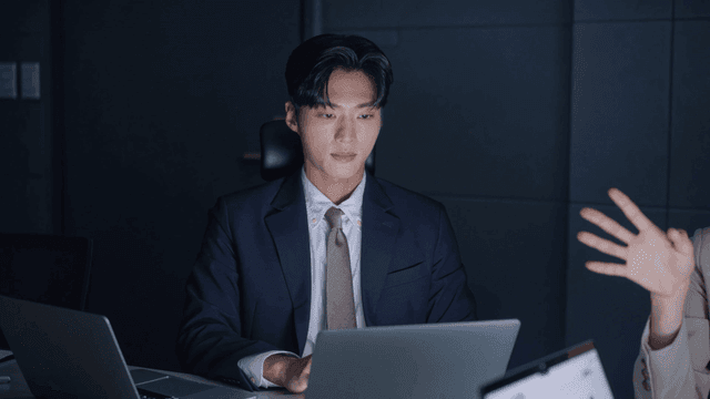 Business meeting in a dimly lit office
