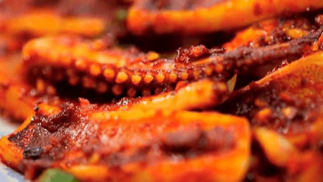 Spicy stir-fried squid on a plate