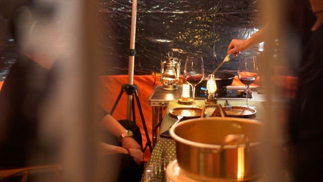 Cozy tent where dinner is being prepared