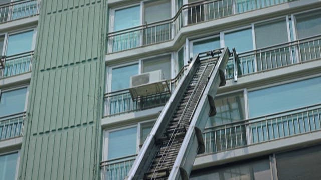 Ladder Moving to the Window of an Apartment on Fire