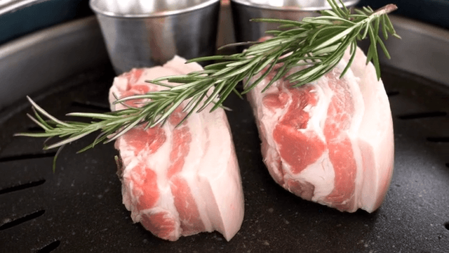 Grilling pork belly with rosemary