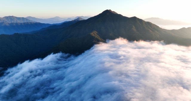 Mountain peak surrounded by clouds