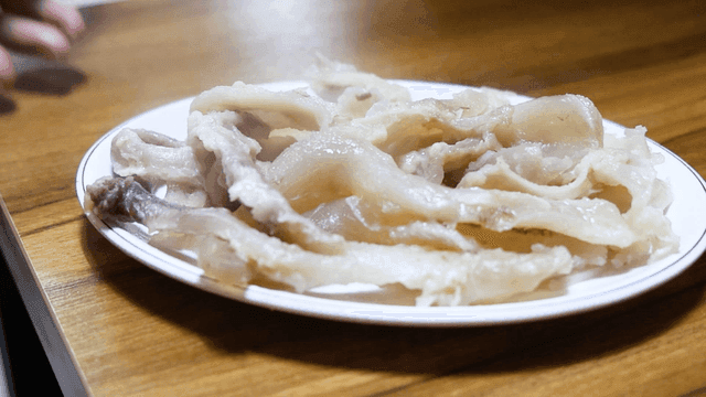 Boiled, plump head meat placed on table