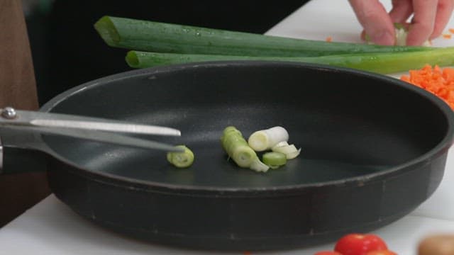 Chopping Green Onions in a Frying Pan