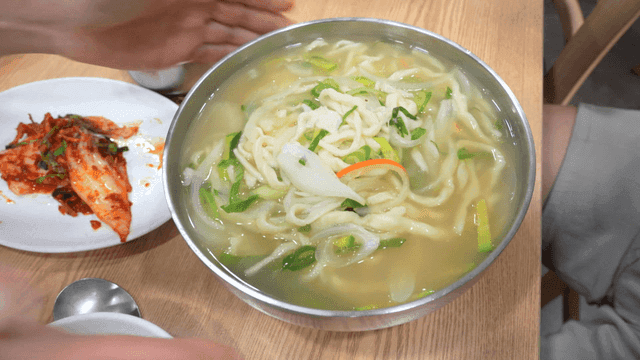 Hand-cut Korean noodles served with kimchi