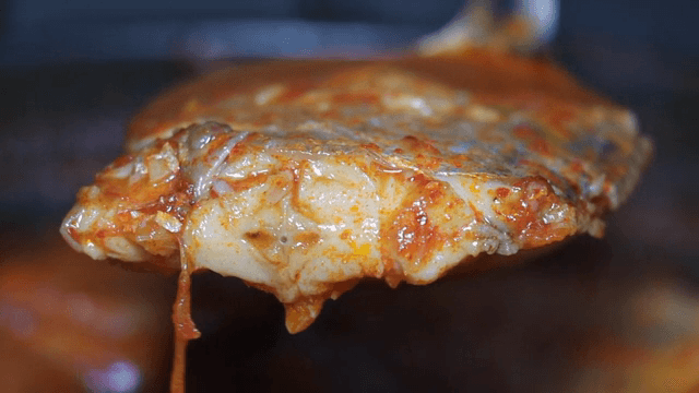 Braised cutlassfish simmering in a pot