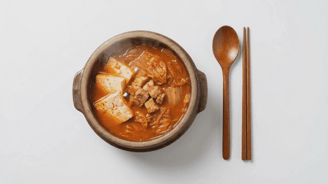 Kimchi stew served in earthenware pot
