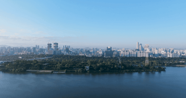 City skyline with river in background.