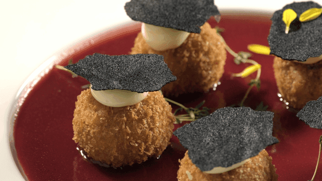 Gourmet dish with crispy croquettes