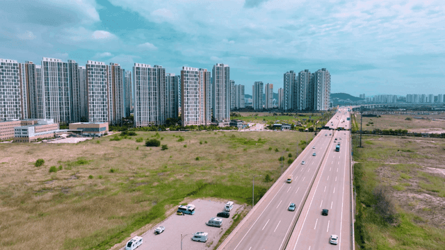 Highway beside modern city skyscrapers