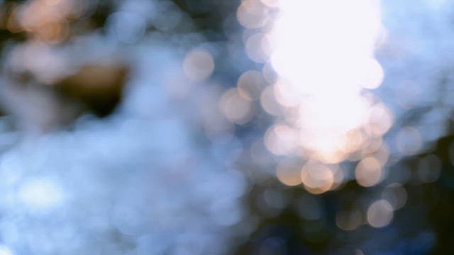 light reflecting on a flowing river