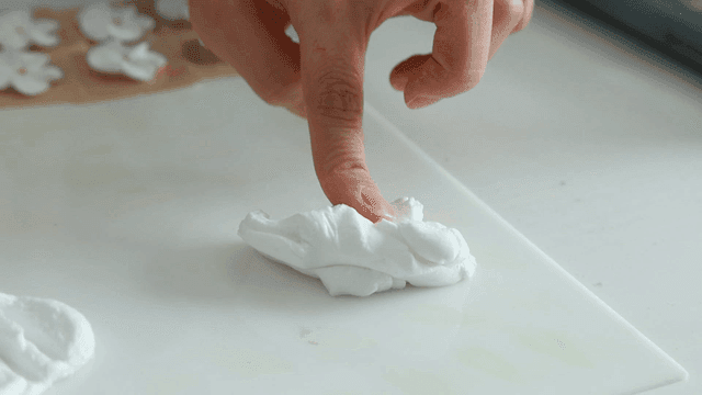 White clay felt with fingers