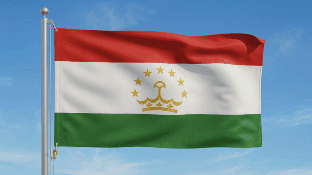 Tajikistani flag fluttering under clear sky