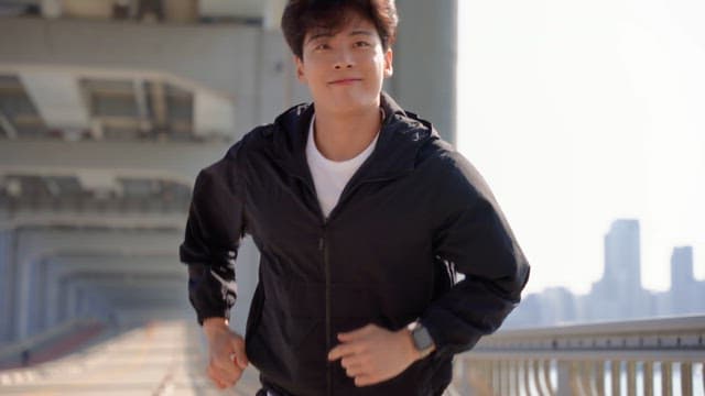 Man jogging on a jamsu bridge