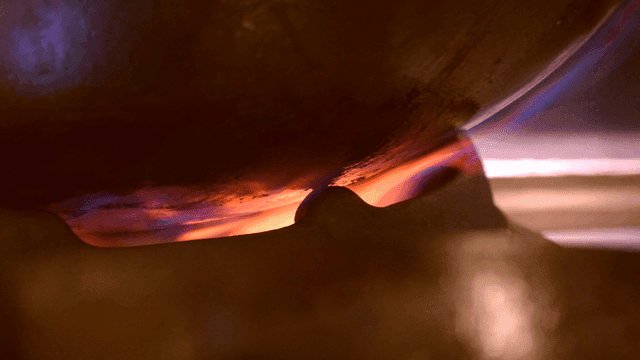 Wok placed over flame