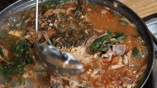 Potato stew boiling in pot