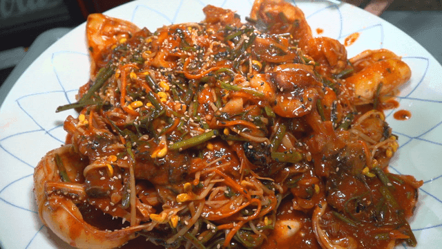 Spicy whole cuttlefish seafood stew on plate