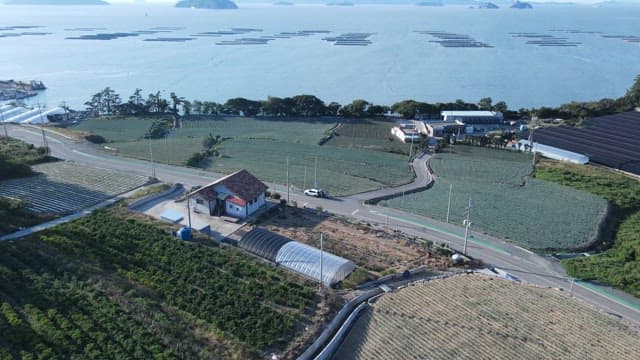 Coastal farmlands with sea and islands in view