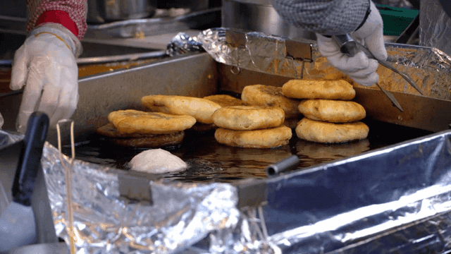 Traditional hotteok cooked on iron plate