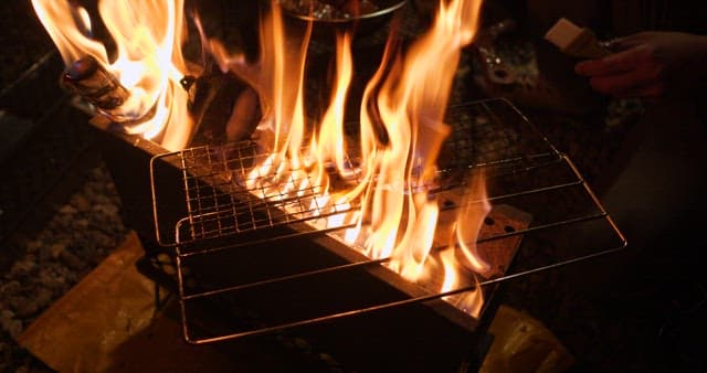 Sizzling squid being cooked on a grill