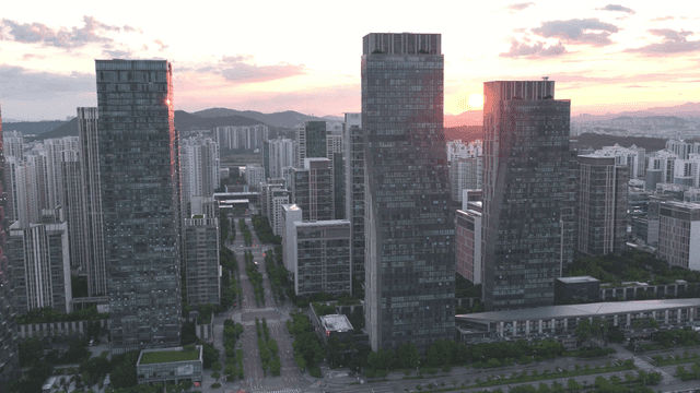 Sunset over a modern city skyline