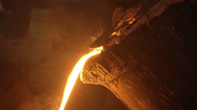 Molten metal pouring into a mold