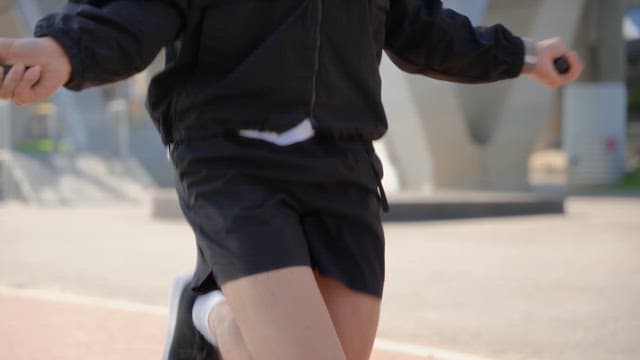 Man skipping rope under a bridge